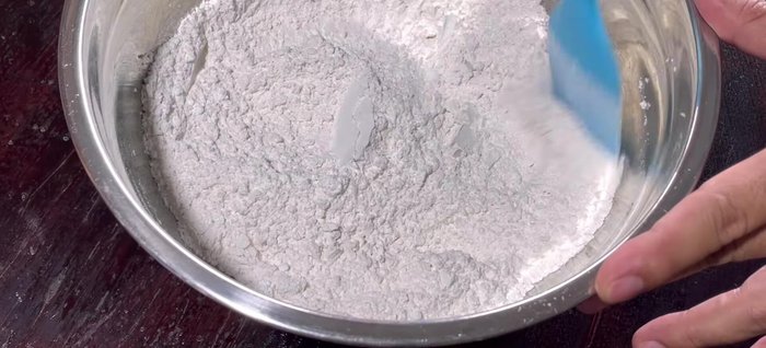 Gradually add water, mixing until a dough forms. Don't overmix or knead. Let the dough rest for 10-15 minutes, then knead for 2-3 minutes until smooth. Rest again for 30 minutes.