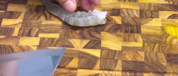 Split the back of each shrimp lengthwise, but not completely in half.