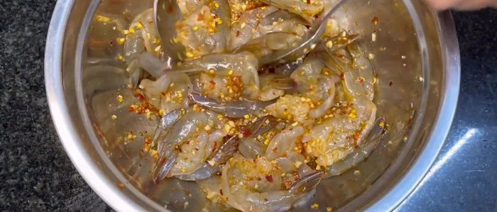 Arrange the marinated shrimp on a tray and dry in the sun for 3-4 hours, flipping halfway.