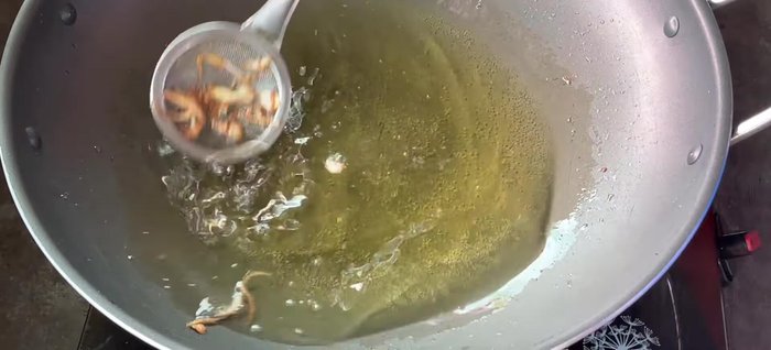 Fry the cassava in the shallot-infused oil over medium heat until slightly golden. Don't overcook.