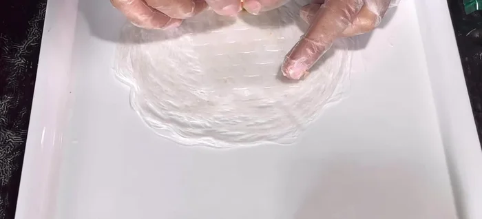 Add a small amount of filling and a whole shrimp to each wrapper. Use egg white to seal the edges.