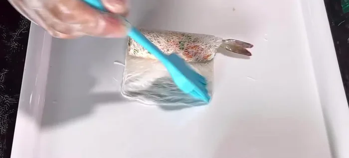 Roll the spring rolls tightly but not too firm to prevent bursting during frying.