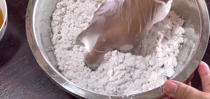 Mix wet and dry ingredients: Gently mix the jackfruit with the dry ingredients. Add the cooled sugar syrup gradually, mixing until well combined. The batter will be thick.