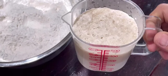 Mix the dough: Add the yeast mixture to the flour mixture. Use a whisk to mix until combined, then use your hands to knead for 5-6 minutes until smooth and slightly sticky. Add 2 tablespoons of cooking oil during kneading.