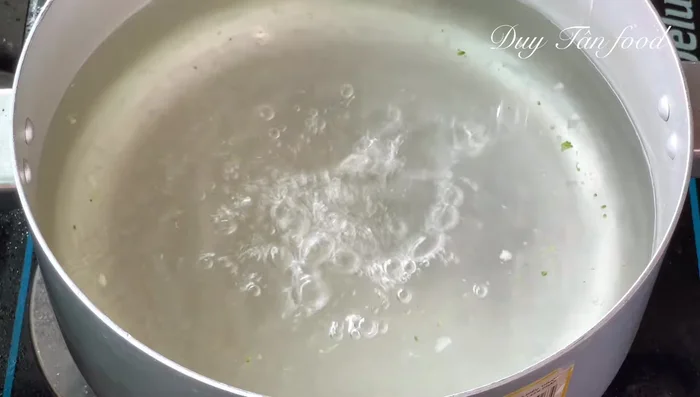 Prepare seafood: Blanch shrimp and squid in boiling water with white wine to remove fishy smell. Drain immediately.