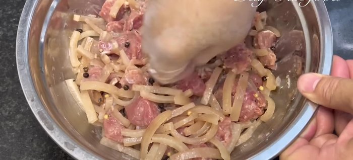 Add the minced pork (350g) to the mixture. Mix everything very well, ensuring even distribution of ingredients.