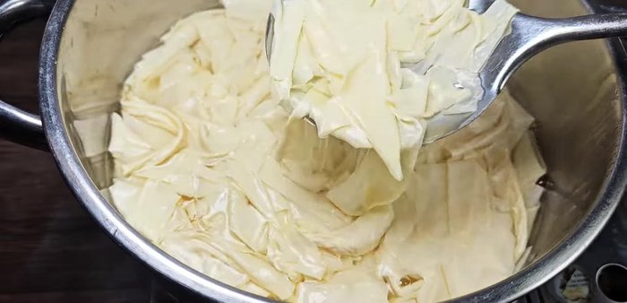 Grind the boiled tofu leaves using a meat grinder until smooth.