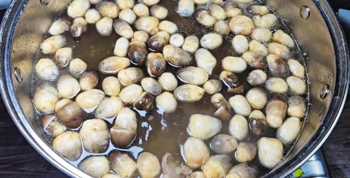 Add remaining ingredients: Once the meat is tender, add straw mushrooms and carrots. Cook until softened. Slice the fish cake and add to the soup.