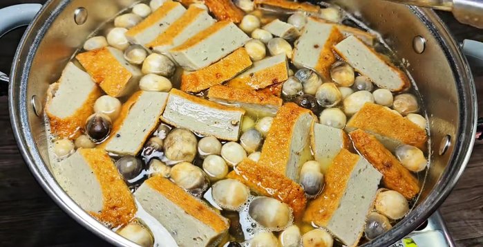 Finish the soup: Add quail eggs and fish cake to the broth. Cook until fish cake floats.