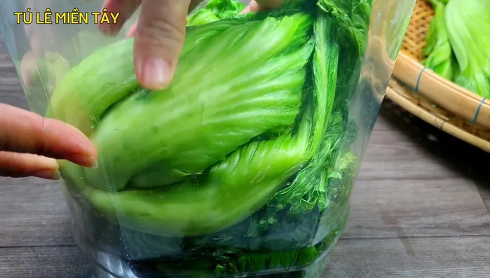 Place the drained cabbage in a large jar or container. Pour the cooled pickling liquid over the cabbage, ensuring it's fully submerged. Press down on any cabbage that floats to the top.