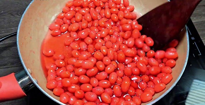 Reduce heat to low, continue stirring to prevent burning, and cook until the sugar water thickens and the jam is glossy. Do not cook until completely dry.