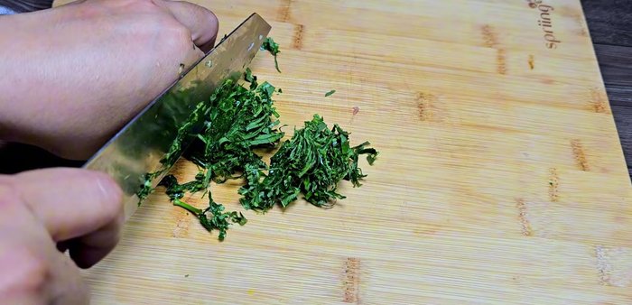Finely chop the lolot leaves for adding to the meat mixture.