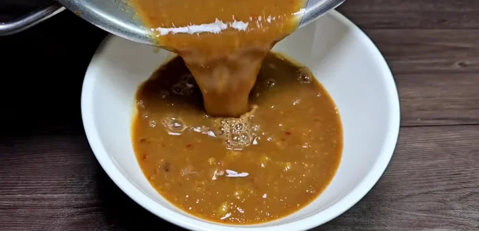 Remove from heat and let cool. Add additional garlic and chili once cooled.