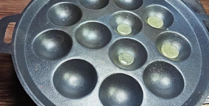 Heat cooking oil in the non-stick molds.