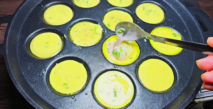 Pour batter into each mold. Add shrimp, a spoonful of coconut milk, and a small amount of the stir-fried meat to each mold.