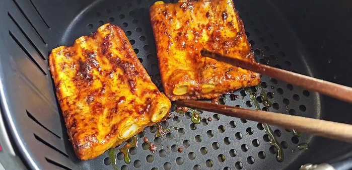 Flip the ribs and grill for another 6 minutes. Add more marinade during the grilling process.