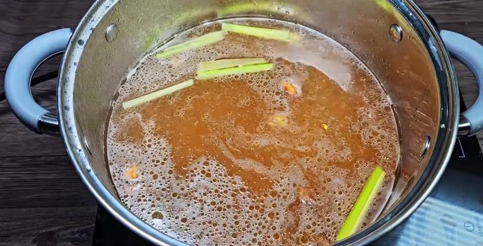 Add sugar, MSG, and salt to the boiling broth.