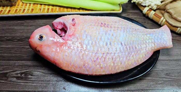 Prepare all ingredients: Clean and cut the fish, vegetables, and mushrooms.