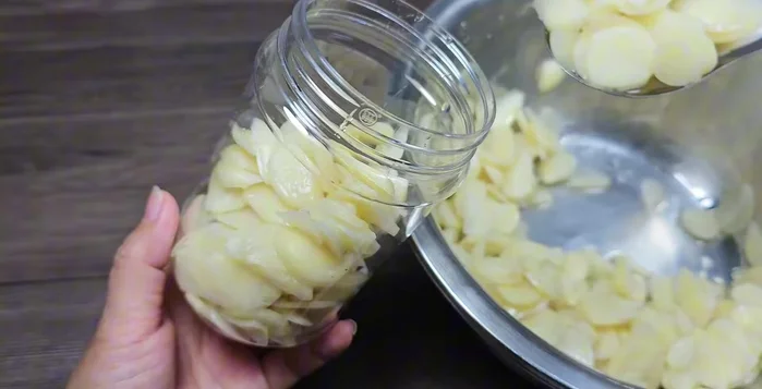 Evenly distribute the marinated garlic into three (or one large) jars.