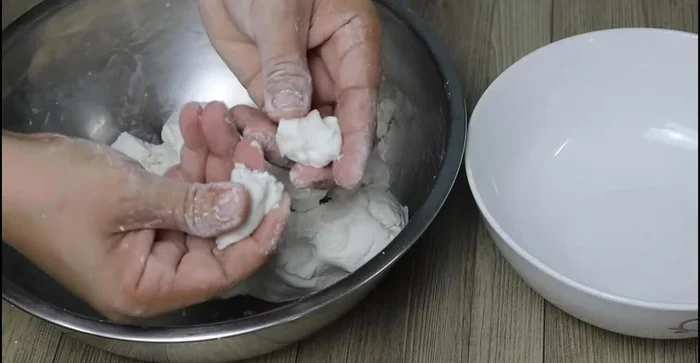 Roll the dough into small balls, about the size of a fingertip.