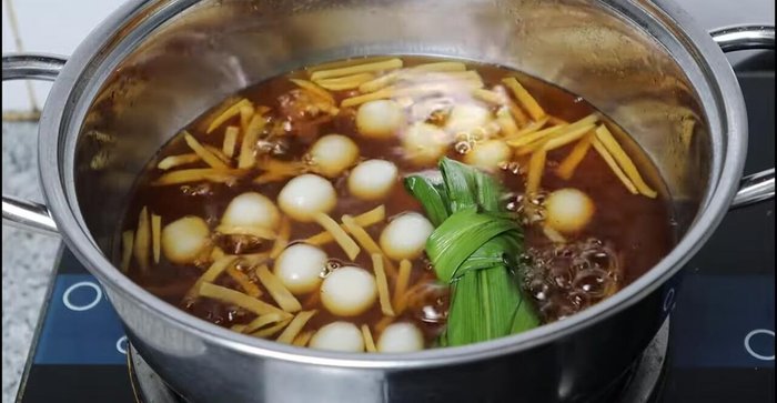 Add the dough balls to the sugar syrup and simmer for 5 minutes.