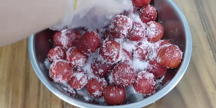 Mix half of the sugar with the plums, then add the remaining sugar on top (125.84).