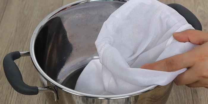 Strain the mixture through a cloth bag or fine-mesh sieve to remove any solids.