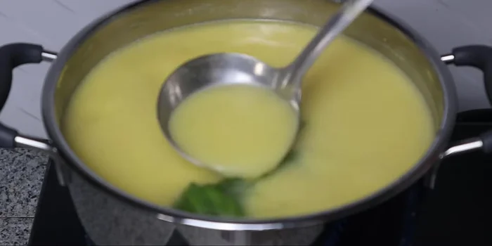 Cook the corn milk until it has reduced and thickened, about 1-2 minutes. The total cooking time will be about 15 minutes.