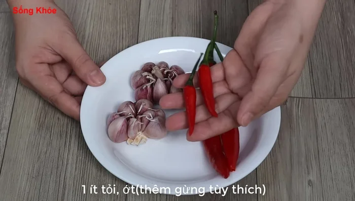 Prepare aromatics: Finely chop garlic and chili peppers. Add ginger if desired. (230.76, 234.2, 236.599, 238.68, 242.079, 244.519, 248.76, 255.68, 259.799, 264)