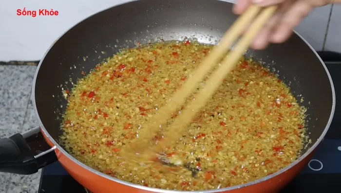 Add lemongrass and chili peppers. Stir-fry until fragrant.