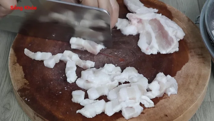 Cut the pork belly into small pieces. You can leave some larger pieces for added texture.