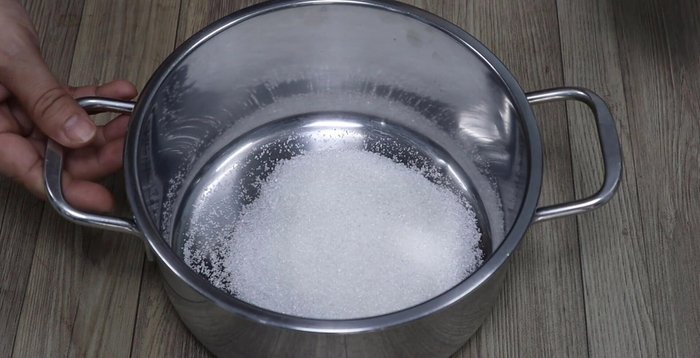 Put sugar, cocoa powder, and Milo powder into a pot.