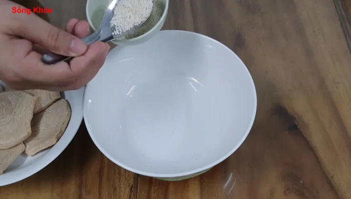 Marinate the ribs with black soy sauce, water, Ninh Trai seeds, and soy sauce. Let it sit for at least 3 days.