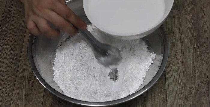 Gradually add coconut milk to the flour mixture, stirring until smooth.