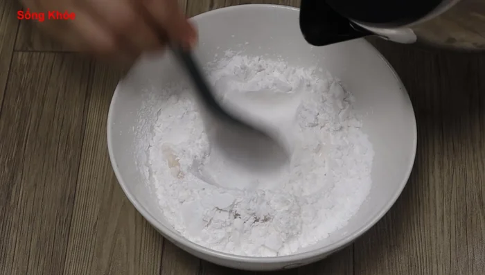 Make tapioca pearls: Gradually add boiling water to tapioca starch until it forms a dough. Knead until smooth and elastic.