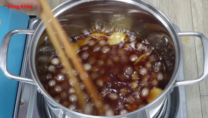 Add the boiled tapioca pearls to the sugar water.