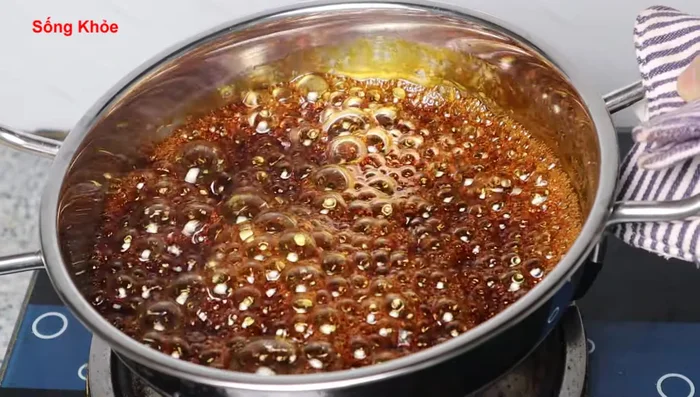 When the sugar starts to release a mass-like consistency, turn off the heat or reduce to lowest setting to prevent burning.