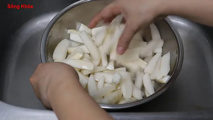 After 2 hours, rinse the salted radish thoroughly with water to remove excess salt.