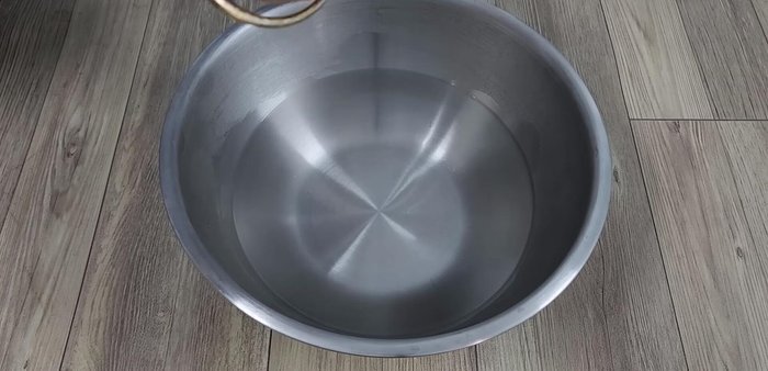 In the boiling water, add and stir the condensed milk until completely dissolved.