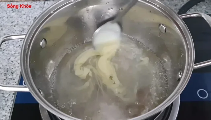Add condensed milk (50ml) and coconut milk (300ml). Cook until it boils.
