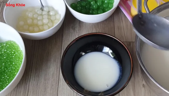 Assemble the sweet soup: Combine the corn, fish, coconut milk mixture, tapioca pearls, and jelly.