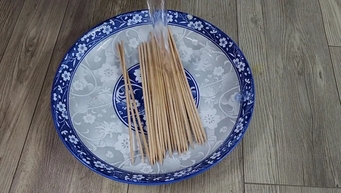 Soak the skewers in boiling water to clean them.