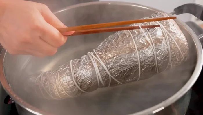 Remove from heat, let cool, and unwrap.