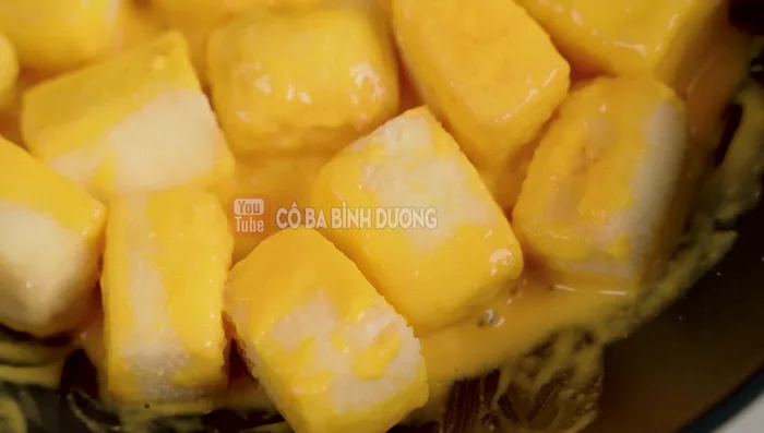 Add the fried tofu to the salted egg sauce and stir well to coat evenly.