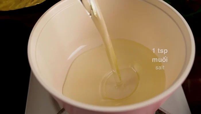 Drain the tofu and coat it with a thin layer of tapioca flour.