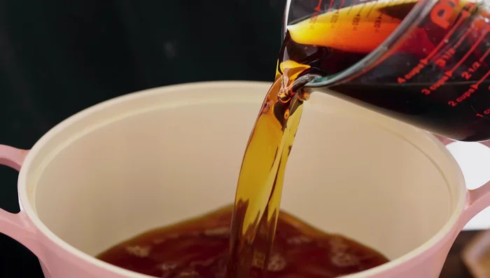 Prepare the fish sauce mixture: Combine fish sauce, sugar, water in a pot. Bring to a boil, skimming off foam. Add star anise, bay leaves, cinnamon, and pepper. Stir well, reduce heat, and simmer until flavors combine. Remove from heat and add ginger, garlic and chilies. Let it cool.