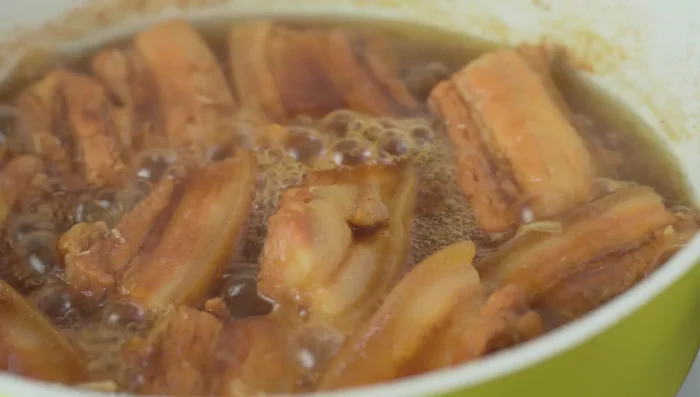 Remove the shallots and garlic. Simmer for another 15 minutes, or until the meat is very tender. Remove the lid and continue simmering until the braising liquid reduces by half.
