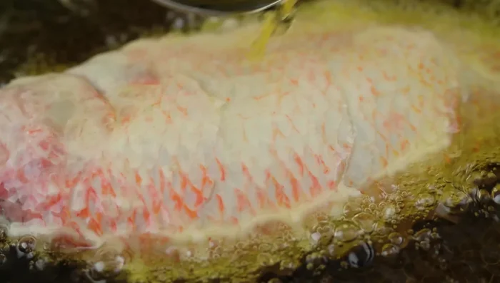 Heat oil in a pan. Fry the fish over medium heat until golden brown on both sides.
