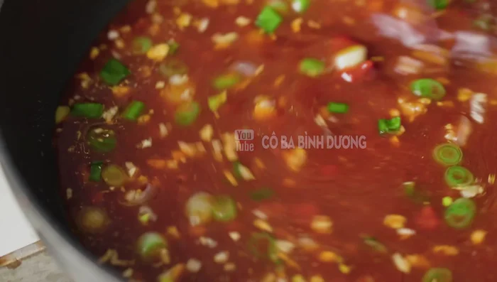 Add the sauce mixture and cook until it boils. Pour the hot sauce over the fried fish.