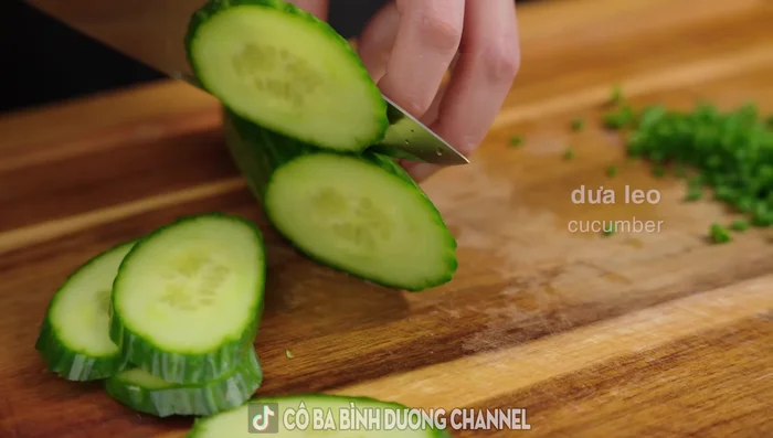 Prepare the vegetables: Chop cucumber, lettuce, and basil. Blanch bean sprouts.